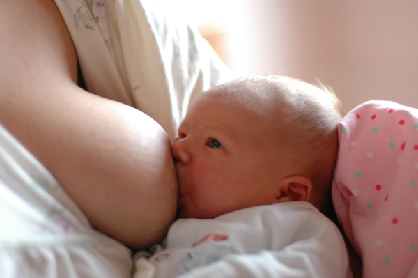 Baby breastfeeding closeup